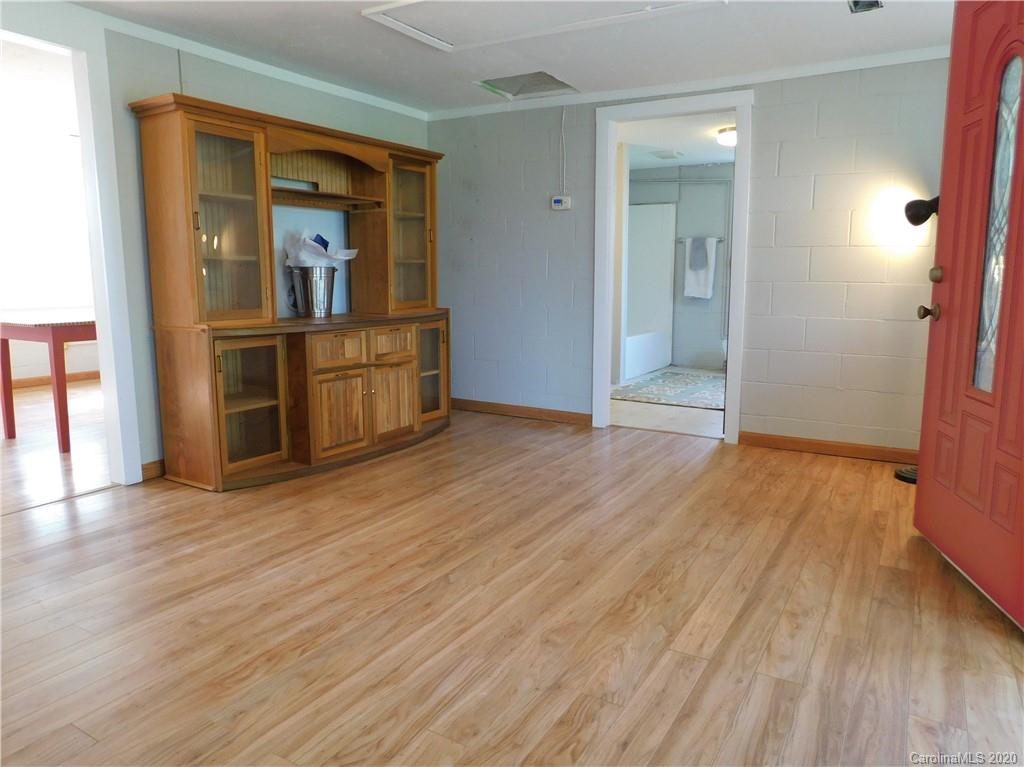 5411 Armfield Mill Road Monroe, NC 28112 - Photo 13 of 33 wooden floor in an empty room with a window