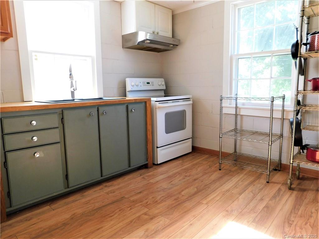 5411 Armfield Mill Road Monroe, NC 28112 - Photo 23 of 33 a kitchen with sink cabinets and window