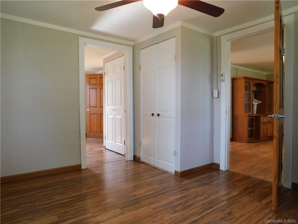 5411 Armfield Mill Road Monroe, NC 28112 - Photo 26 of 33 a view of a hallway with wooden floor