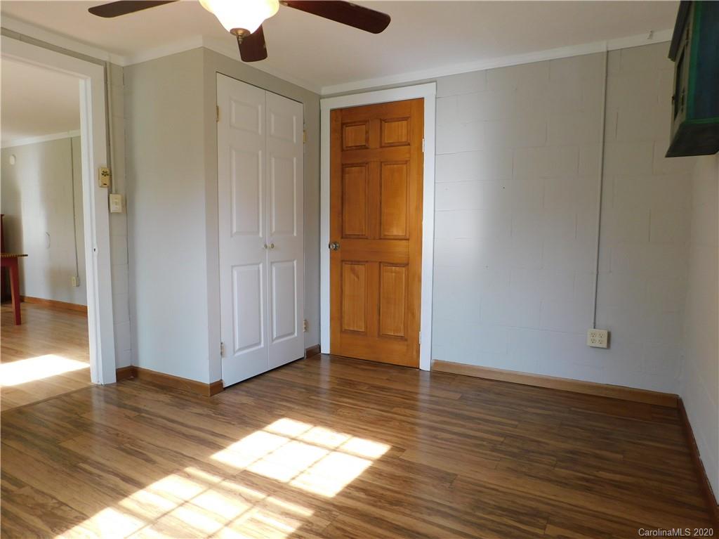5411 Armfield Mill Road Monroe, NC 28112 - Photo 28 of 33 a view of a livingroom with wooden floor window and a kitchen space