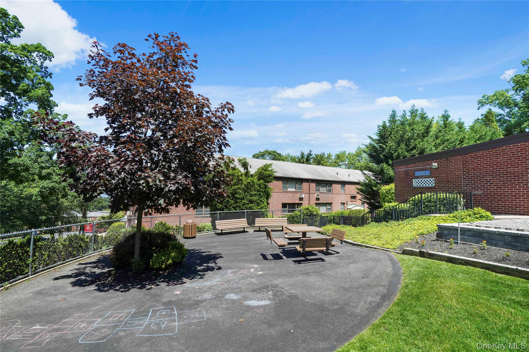 17 Manor House Drive, Unit K14 Dobbs Ferry, NY 10522 - Photo 21 of 31 a view of a backyard with sitting area