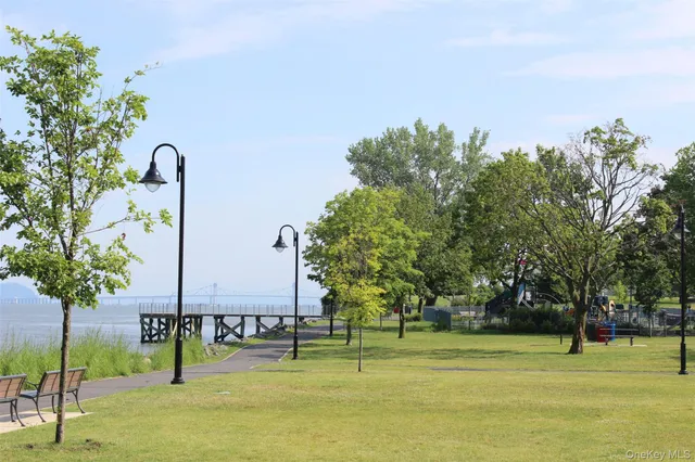 a backyard of apartments with large trees