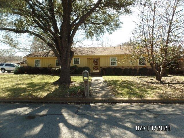a view of house with yard