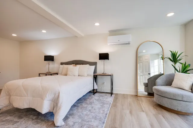 a bedroom with bed and window