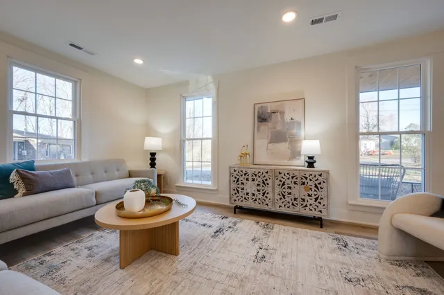 a living room with furniture and windows