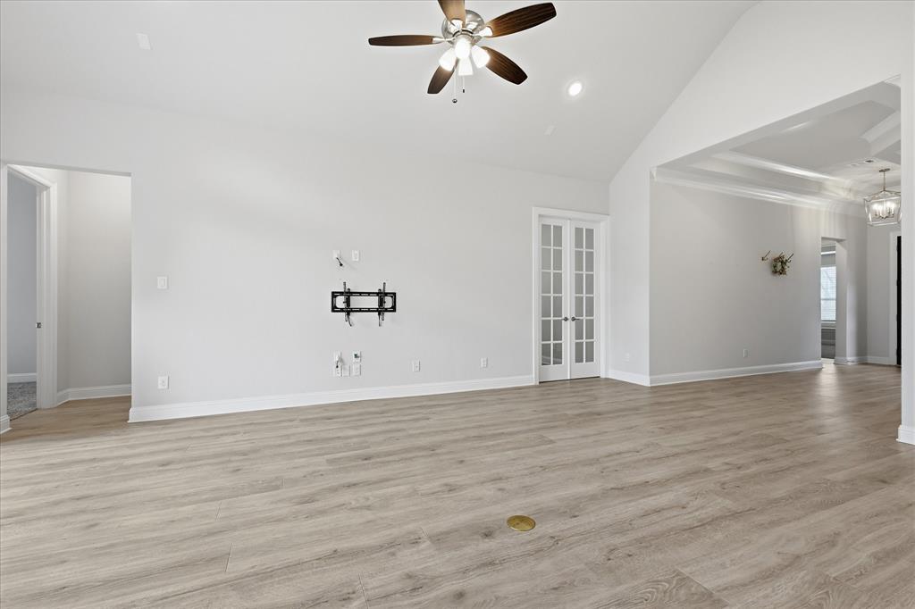 910 Cone Flower Drive Prosper, TX 75078 - Photo 12 of 40 a view of an empty room with window and wooden floor