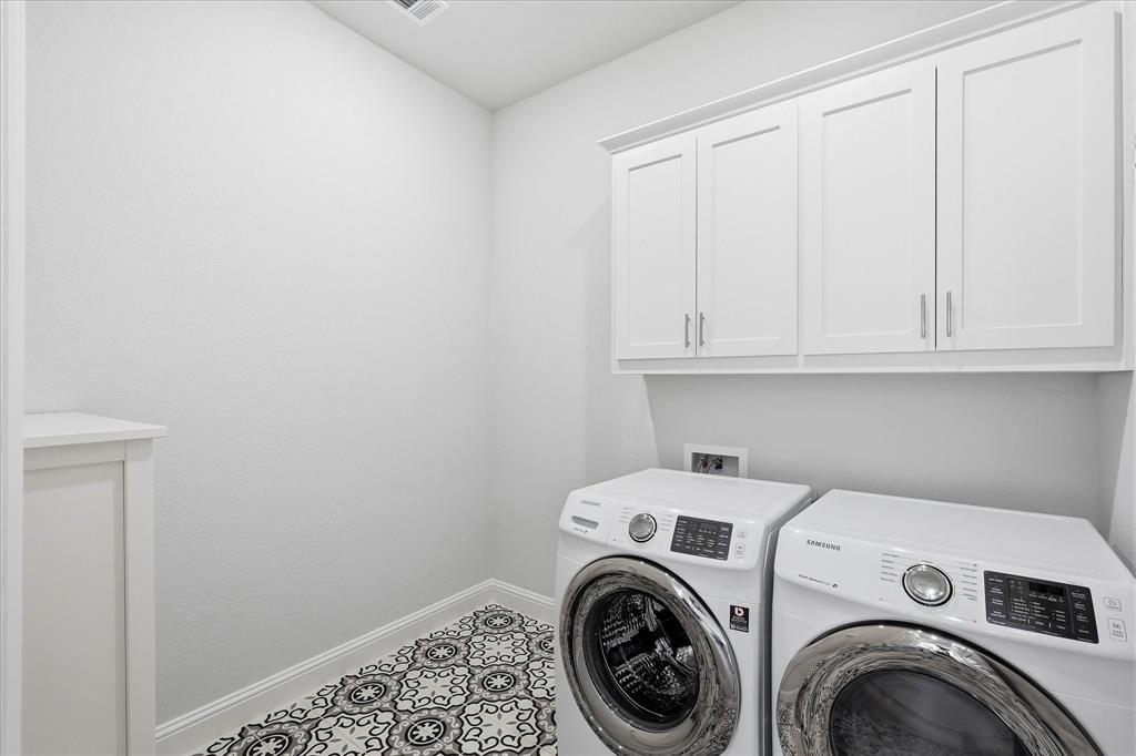 910 Cone Flower Drive Prosper, TX 75078 - Photo 19 of 40 a utility room with dryer and washer