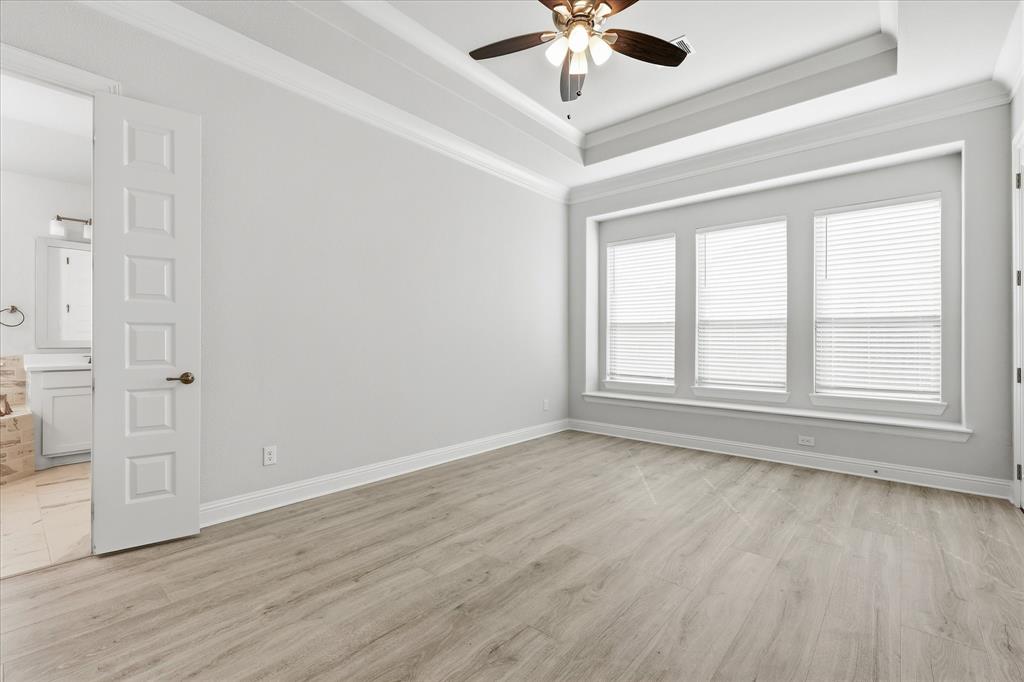 910 Cone Flower Drive Prosper, TX 75078 - Photo 20 of 40 wooden floor in an empty room with a window