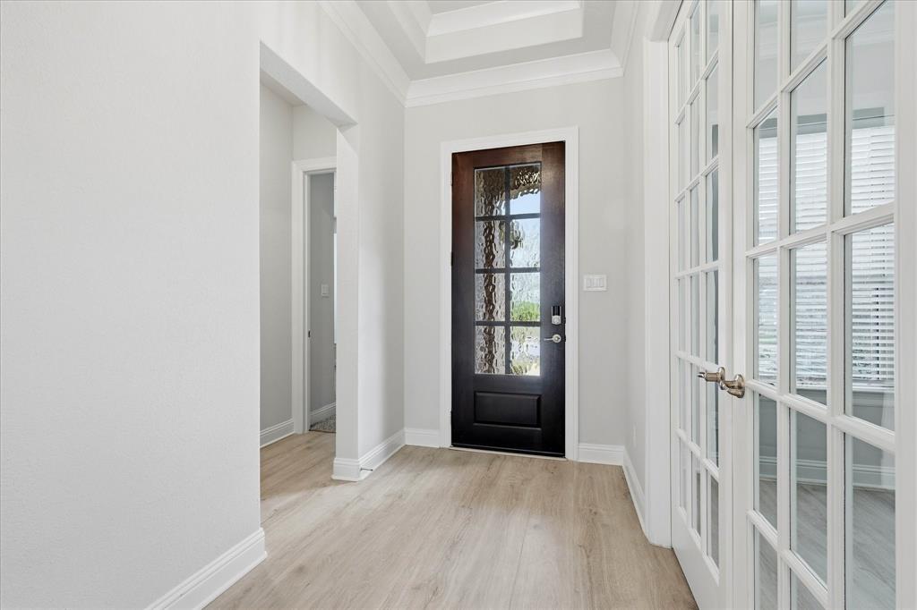 910 Cone Flower Drive Prosper, TX 75078 - Photo 3 of 40 a view of entryway with wooden floor