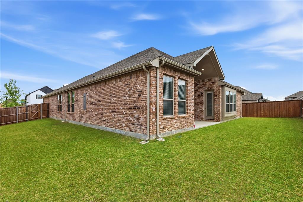 910 Cone Flower Drive Prosper, TX 75078 - Photo 34 of 40 a front view of a house with a yard