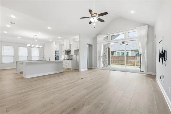 a view of a kitchen with a sink and a window