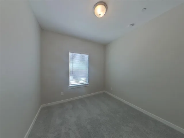 a bathroom with a shower and toilet