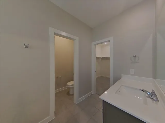 a bathroom with a sink and mirror