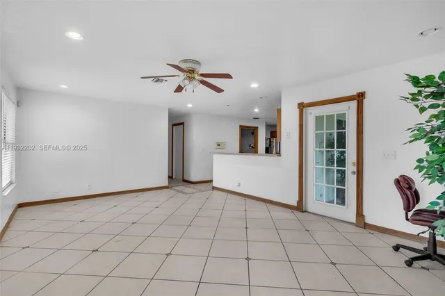 a view of an empty room with a window