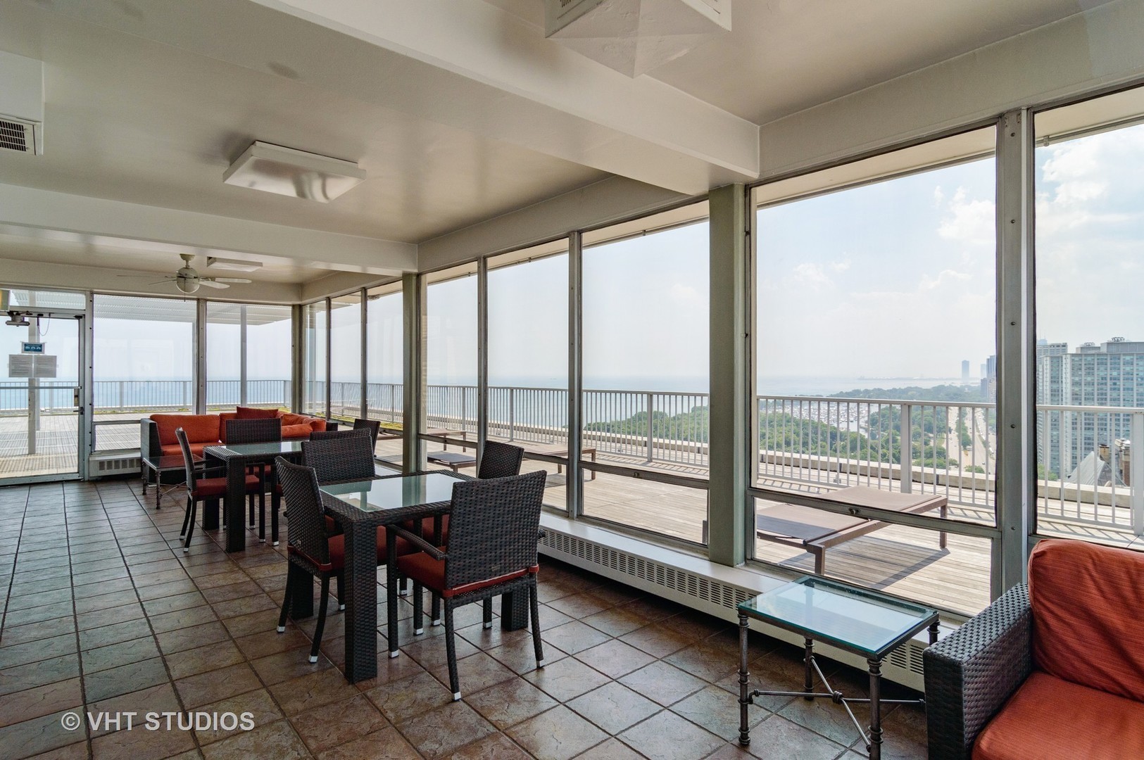 3900 North Lake Shore Drive, Unit 18F Chicago, IL 60613 - Photo 21 of 22 a view of a dining room with furniture and chandelier