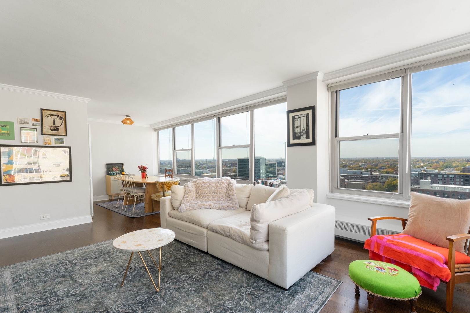 3900 North Lake Shore Drive, Unit 18F Chicago, IL 60613 - Photo 4 of 22 a living room with furniture and a large window