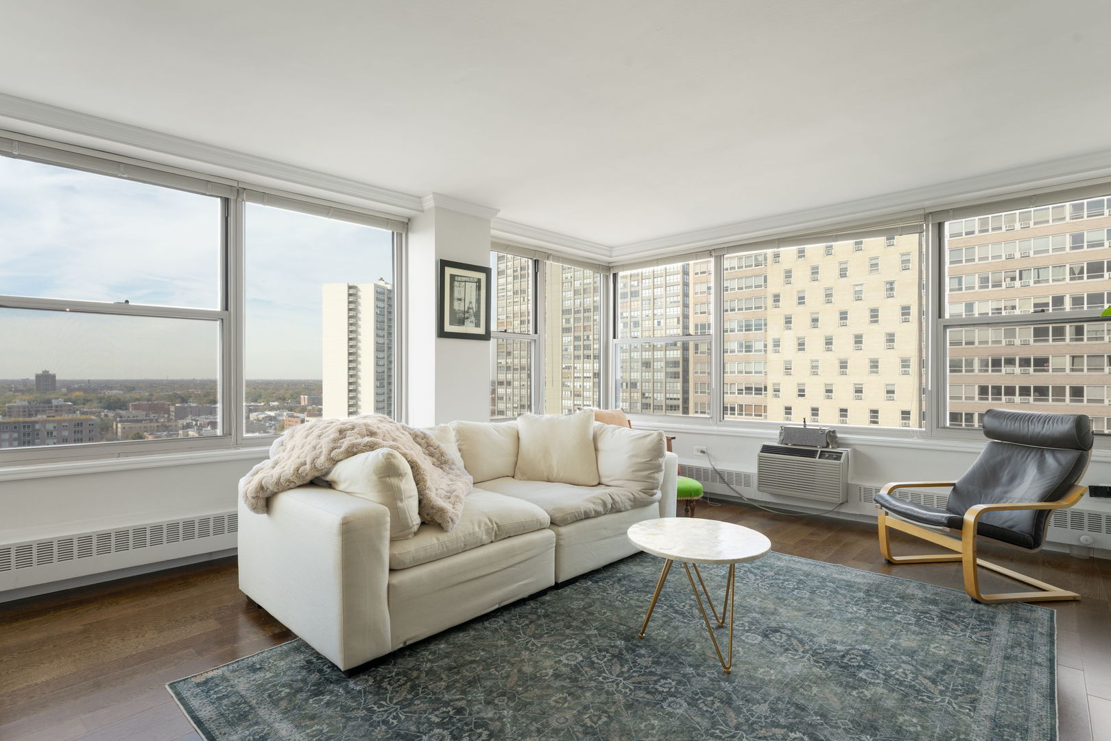 3900 North Lake Shore Drive, Unit 18F Chicago, IL 60613 - Photo 5 of 22 a living room with furniture and a large window