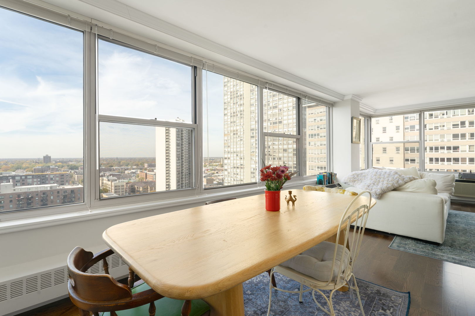 3900 North Lake Shore Drive, Unit 18F Chicago, IL 60613 - Photo 6 of 22 a living room with furniture and a large window
