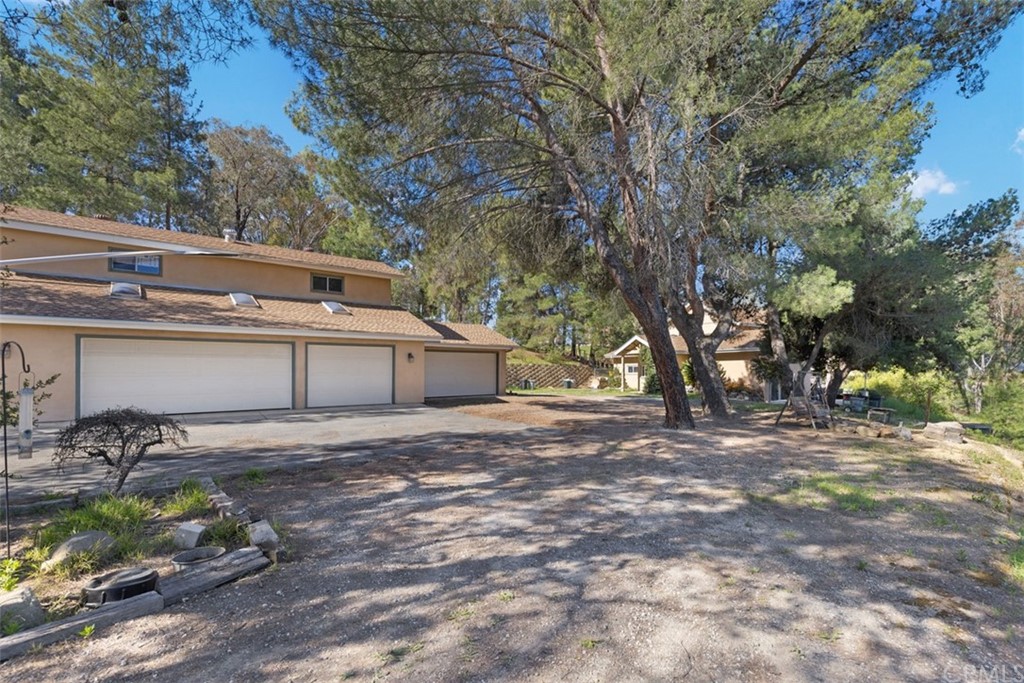 10660 Quail Springs Road Fallbrook, CA 92028 - Photo 1 of 1 a backyard of a house with table and chairs