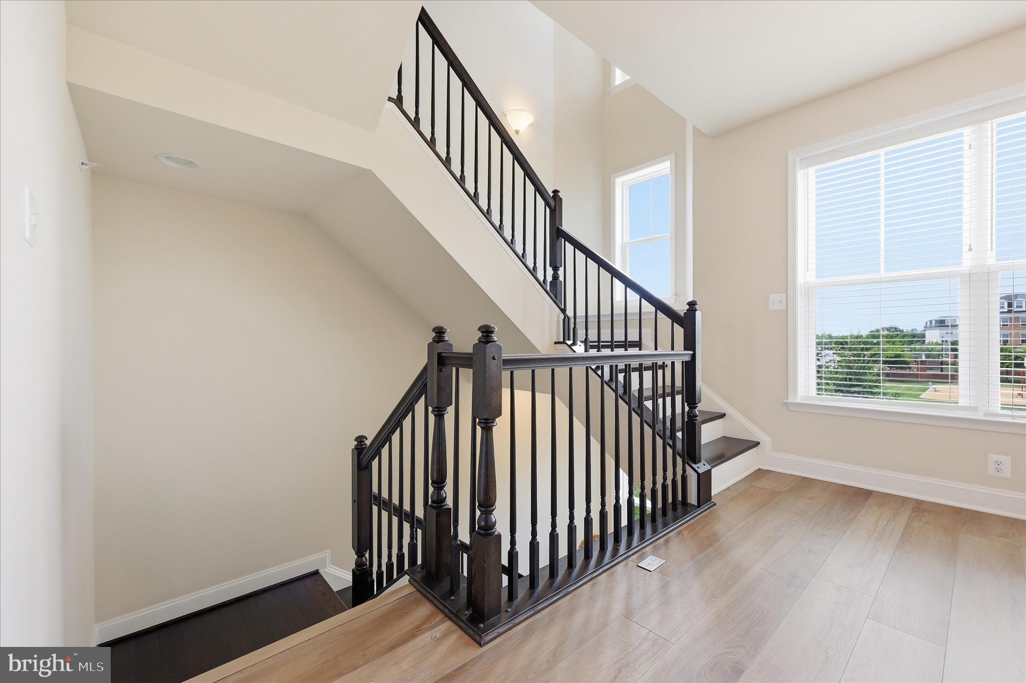1090 Holden Road Frederick, MD 21701 - Photo 15 of 60 a view of hallway with wooden floor and stairs