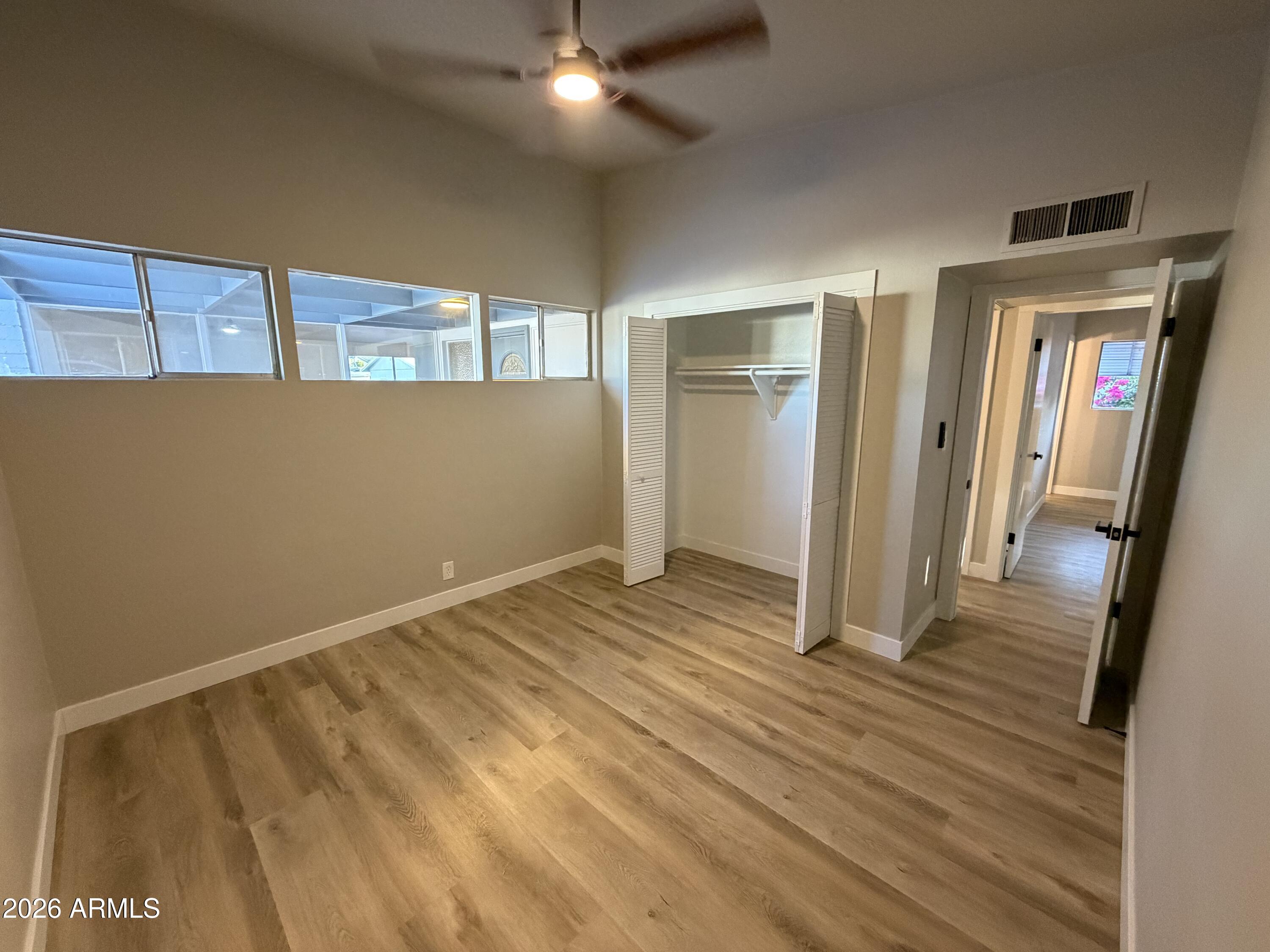 5420 North Granite Reef Road Scottsdale, AZ 85250 - Photo 18 of 30 a view of a room with wooden floor