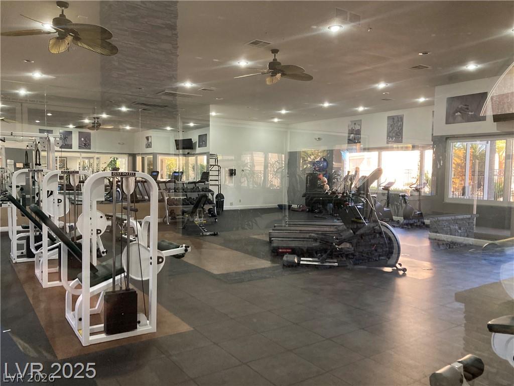 9050 West Warm Springs Road, Unit 1027 Las Vegas, NV 89148 - Photo 36 of 44 Fitness center with ample equipment and a sun-filled atmosphere.