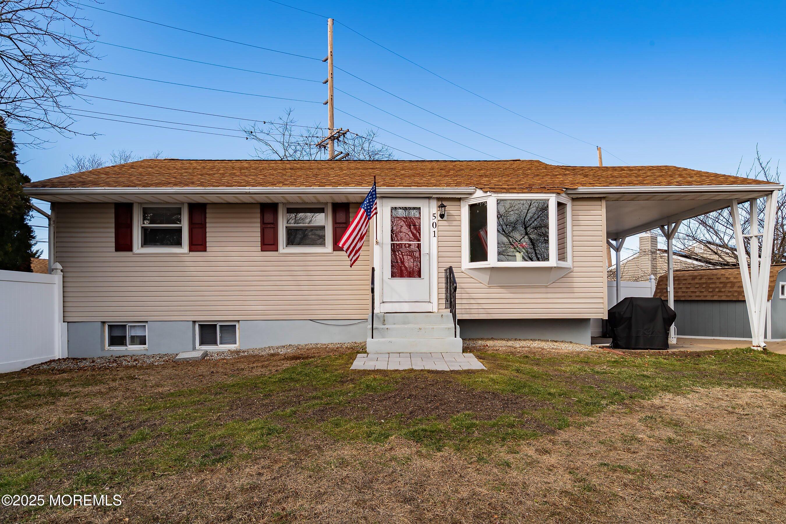 501 Stone Road Union Beach, NJ 07735 - Photo 1 of 30 a front view of a house with garden