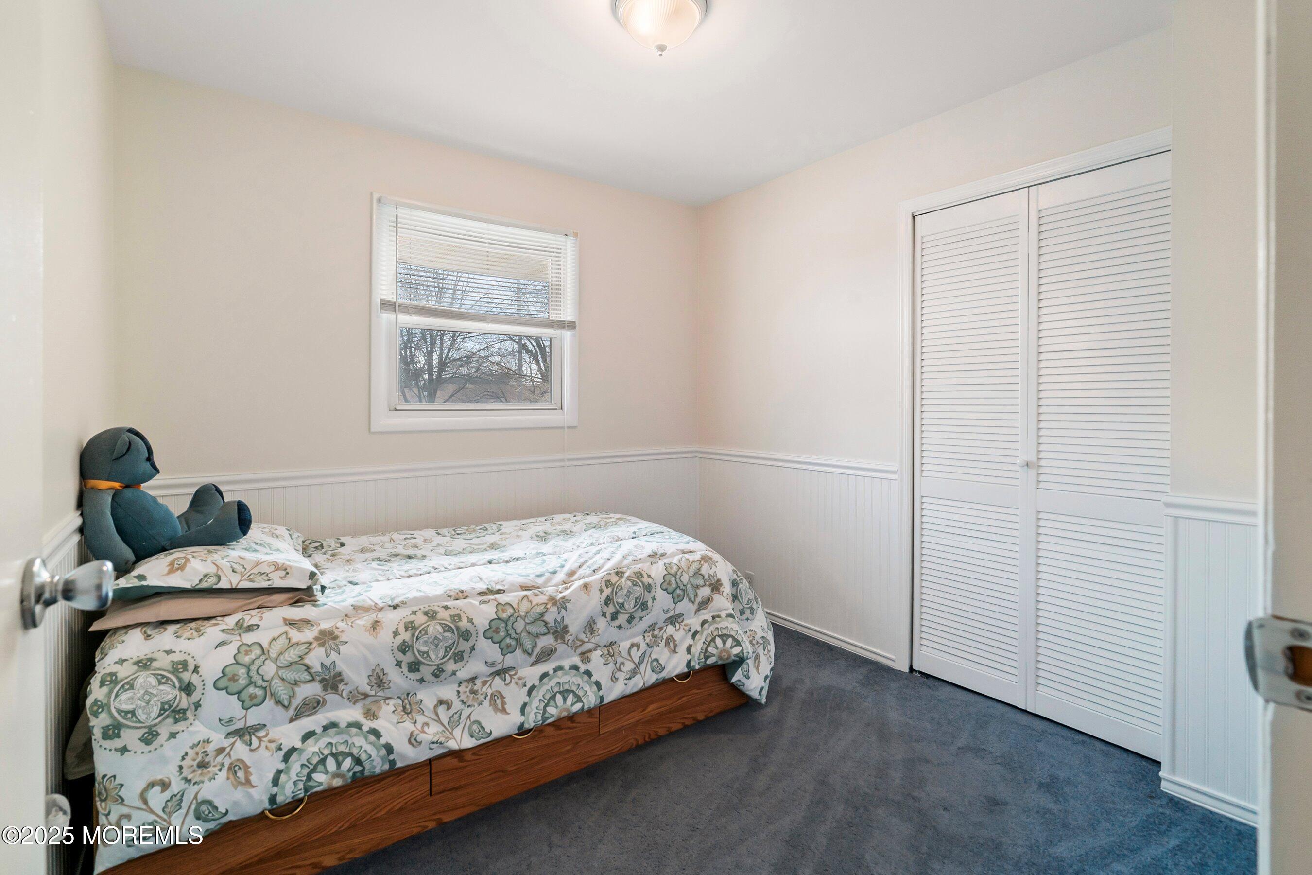 501 Stone Road Union Beach, NJ 07735 - Photo 11 of 30 a bedroom with a bed and a window