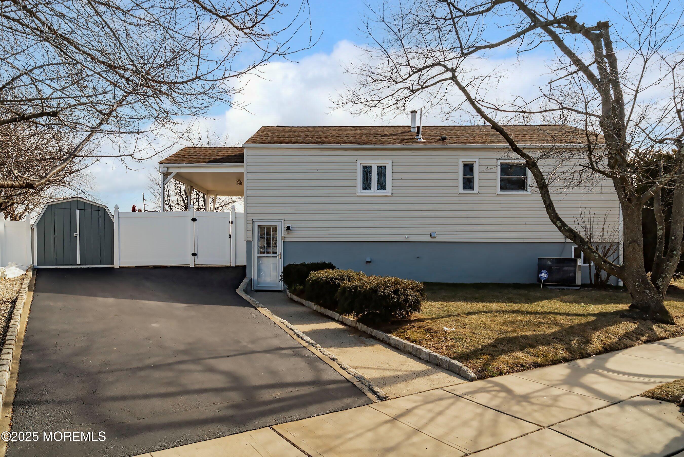 501 Stone Road Union Beach, NJ 07735 - Photo 23 of 30 a view of a house with a snow in the yard