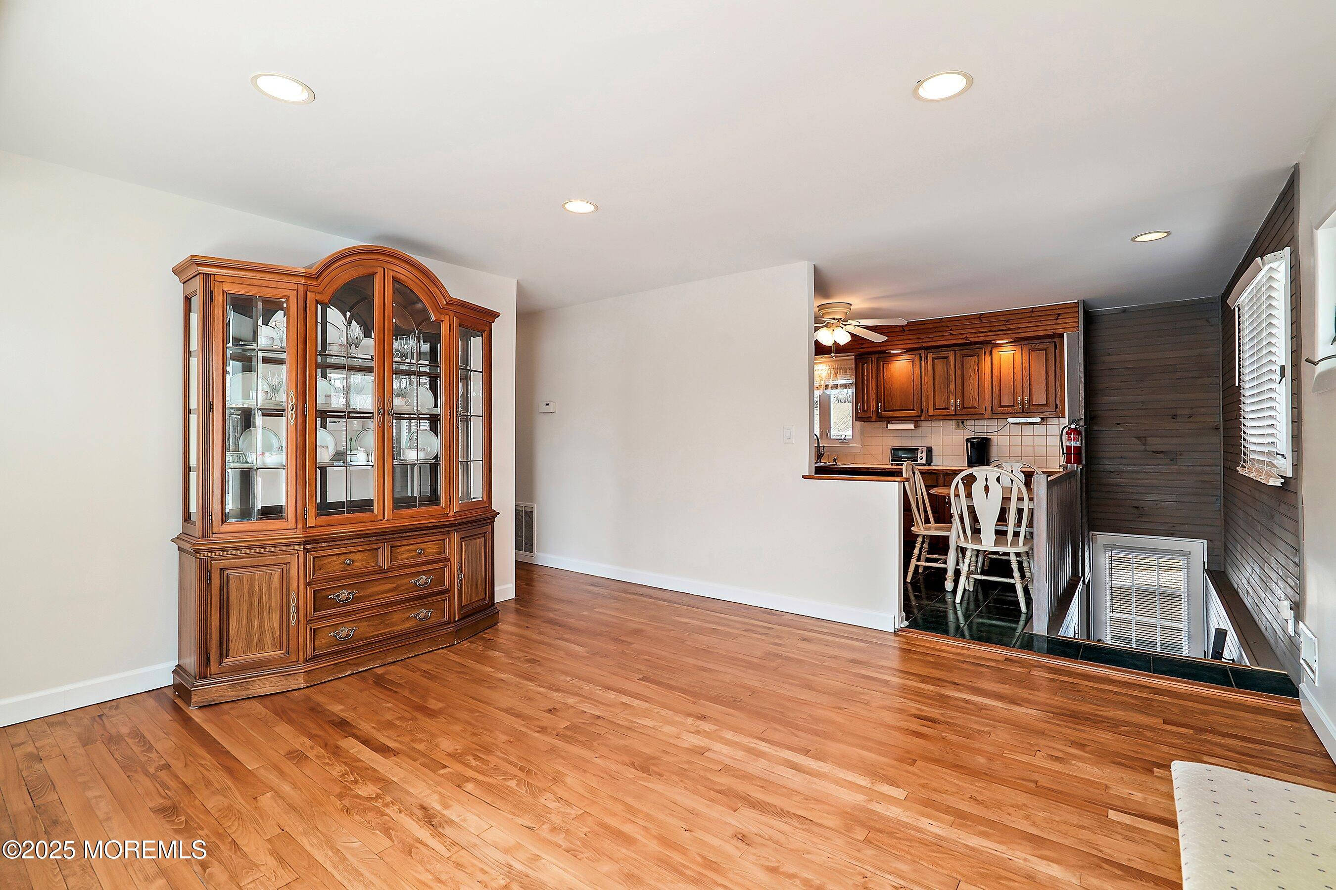 501 Stone Road Union Beach, NJ 07735 - Photo 5 of 30 a view of a kitchen with furniture and wooden floor
