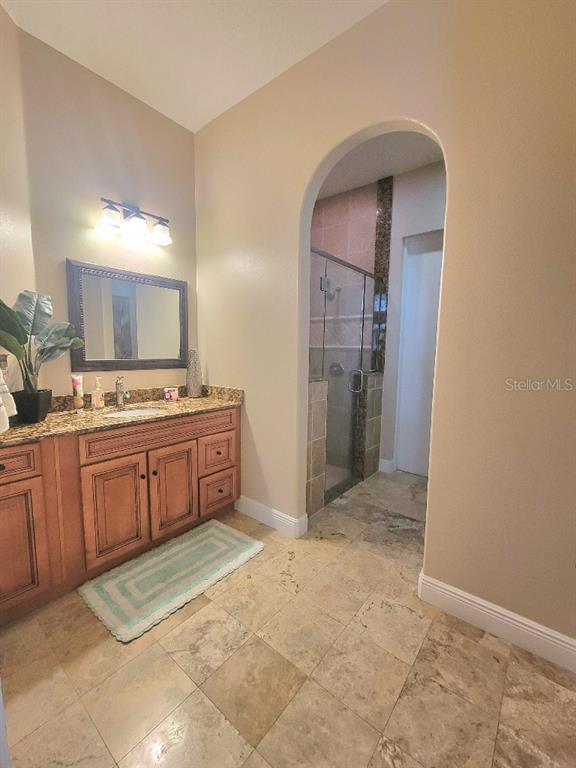 12625 Sweet Hill Road Polk City, FL 33868 - Photo 15 of 32 a kitchen with a sink stove and refrigerator