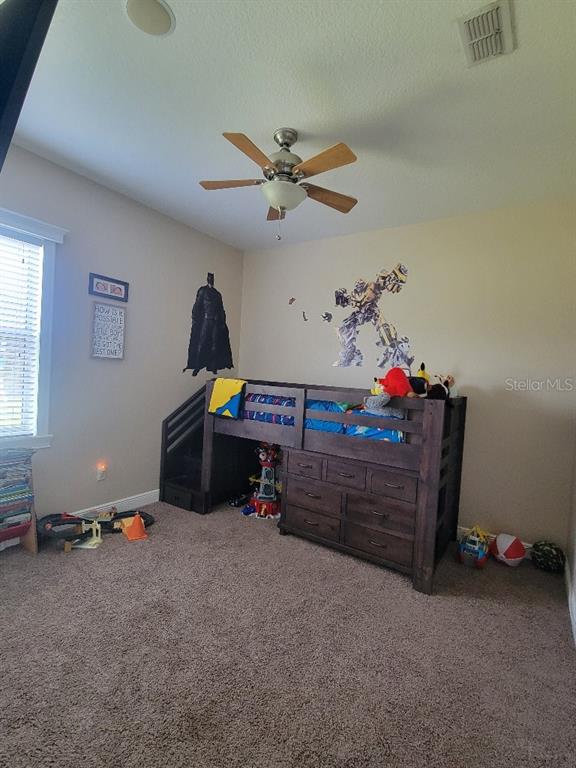 12625 Sweet Hill Road Polk City, FL 33868 - Photo 18 of 32 a play room with toys