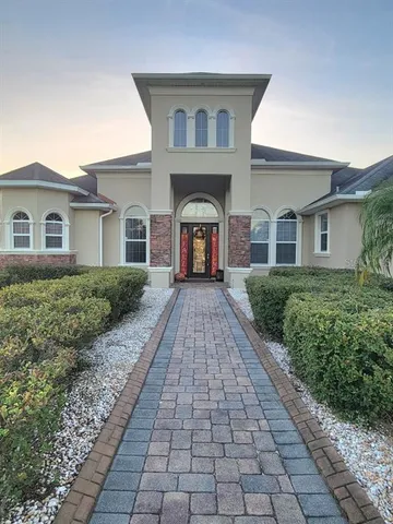 a front view of a house with yard
