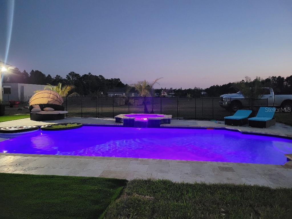 12625 Sweet Hill Road Polk City, FL 33868 - Photo 23 of 32 a view of a tennis court with sitting area