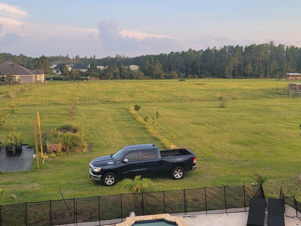 12625 Sweet Hill Road Polk City, FL 33868 - Photo 25 of 32 a view of a lake with a yard