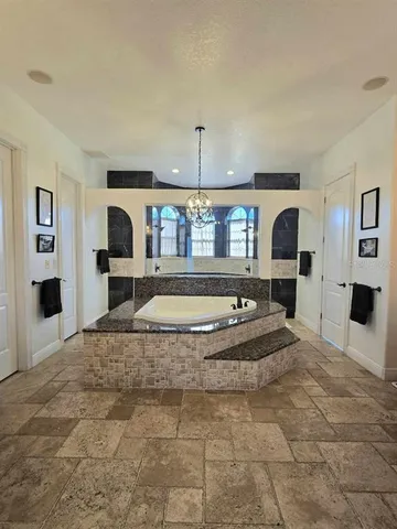 a view of a living room and kitchen with furniture
