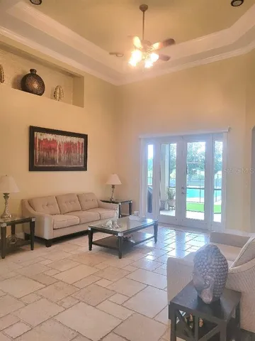 a living room with furniture and a large window