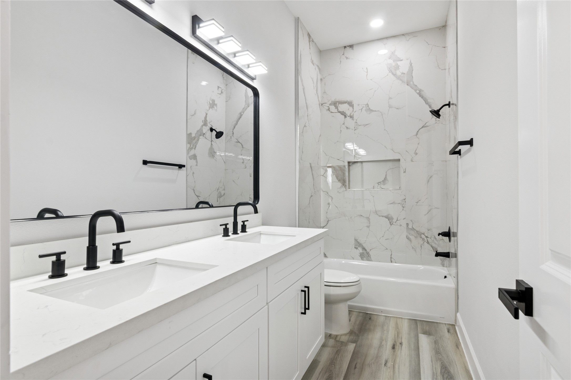 5766 Ward Bend Road Sealy, TX 77474 - Photo 21 of 45 a bathroom with a double vanity sink mirror double and bathtub