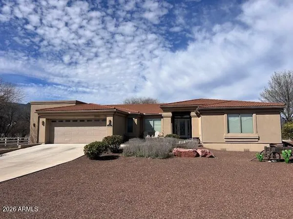 front view of a house with a big yard