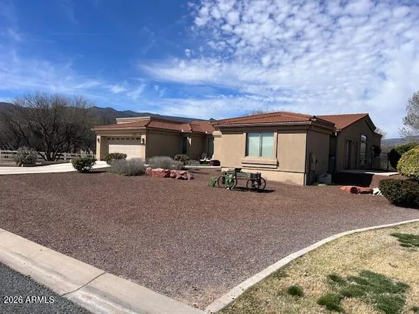 a view of a car park in front of house