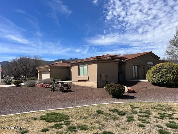 a view of a car parked in front of a house
