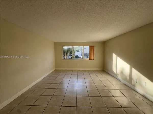 a view of an empty room and window