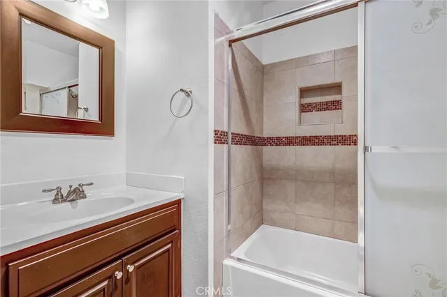 a bathroom with a bathtub and a sink