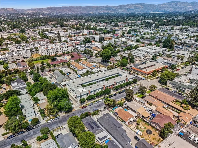 an aerial view of residential houses with outdoor space