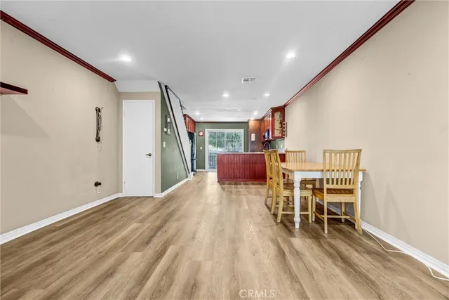 a view of a livingroom with furniture and wooden floor
