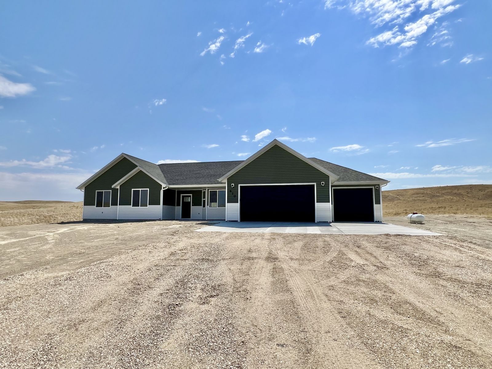 610 Ridgeway Drive Spring Creek, NV 89815 - Photo 1 of 33 a big house with a big yard and large trees