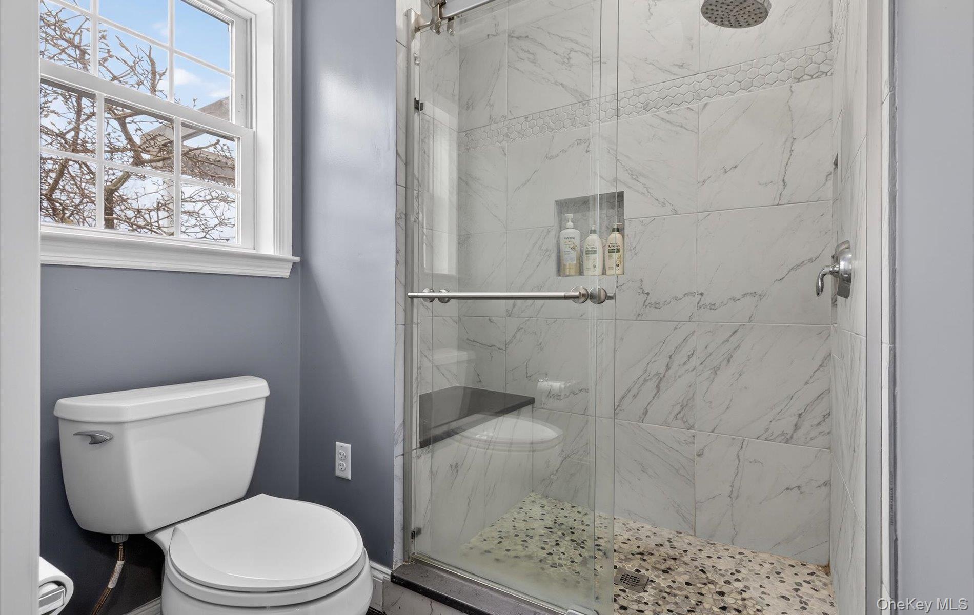 108 Awixa Avenue Bay Shore, NY 11706 - Photo 21 of 47 Bathroom featuring toilet and a marble finish shower