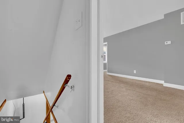 a room with furniture and white walls