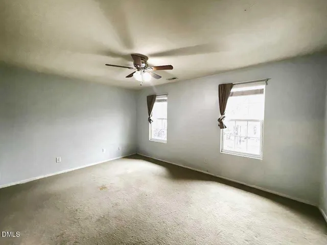 a bathroom with a sink toilet vanity and shower
