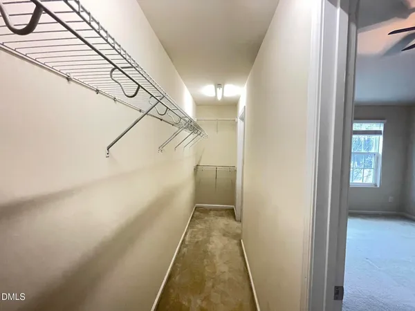 a view of a hallway with stairs